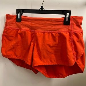 Lululemon orange speed up shorts size 6